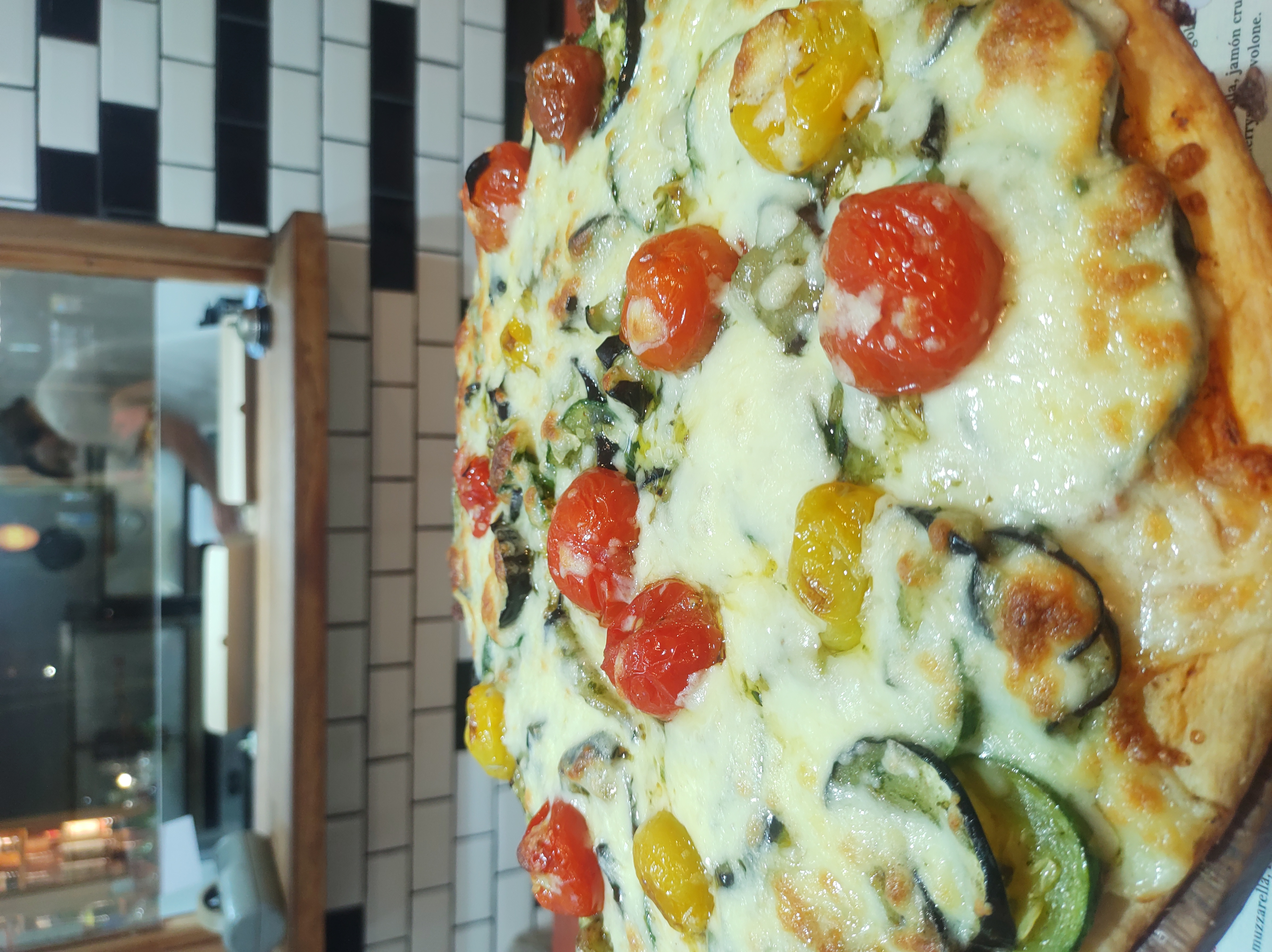 Caprese pizza with cherry tomatoes